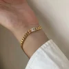 Guldarmband med 18K förgyllning med CZ 17+2 cm>Celine Estelle New